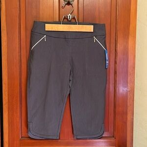 Golf shorts. Brand new GG Blue luxe sport with tags. Smoke Grey size 10